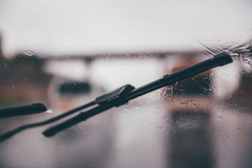 Shallow focus photography of black vehicle wiper blade