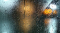 Wet car window with rain droplets