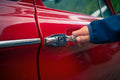 Person holding car door open