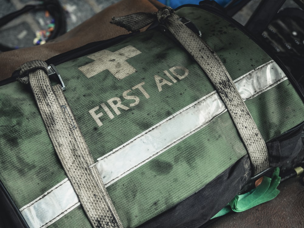Green and black first aid bag