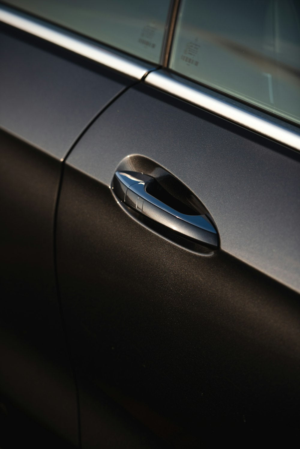 Black car door edge close-up
