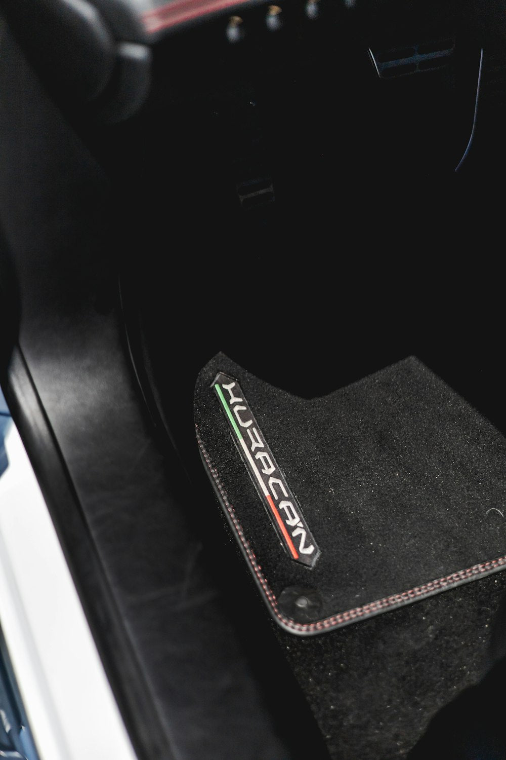 Car interior with black rubber floor mat