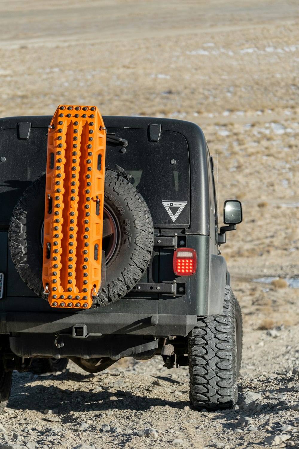 Black and yellow Jeep Wrangler off-road