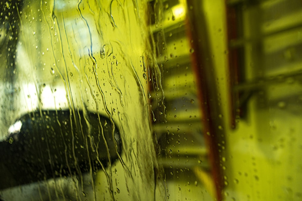 View through rain-covered car window