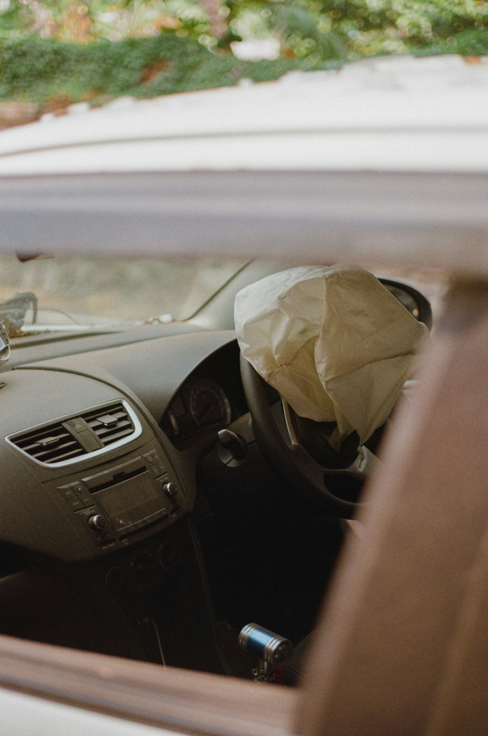 Car interior with paper bag in passenger seat