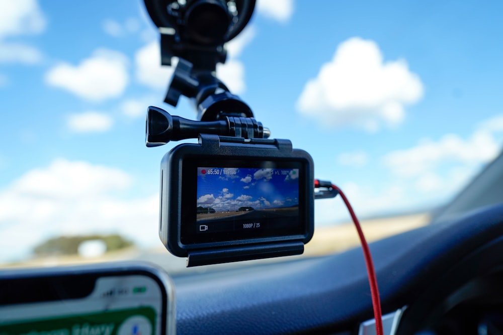 Dash camera mounted on car windshield dashboard