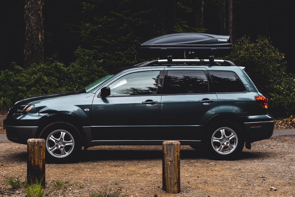Car with rooftop cargo on road