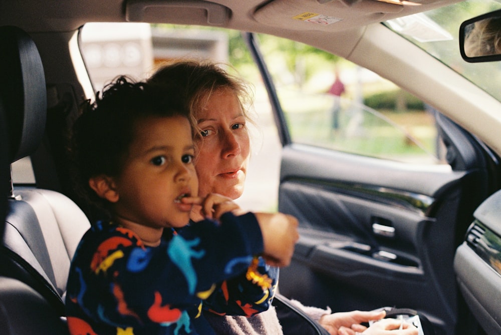 Person and child in a car