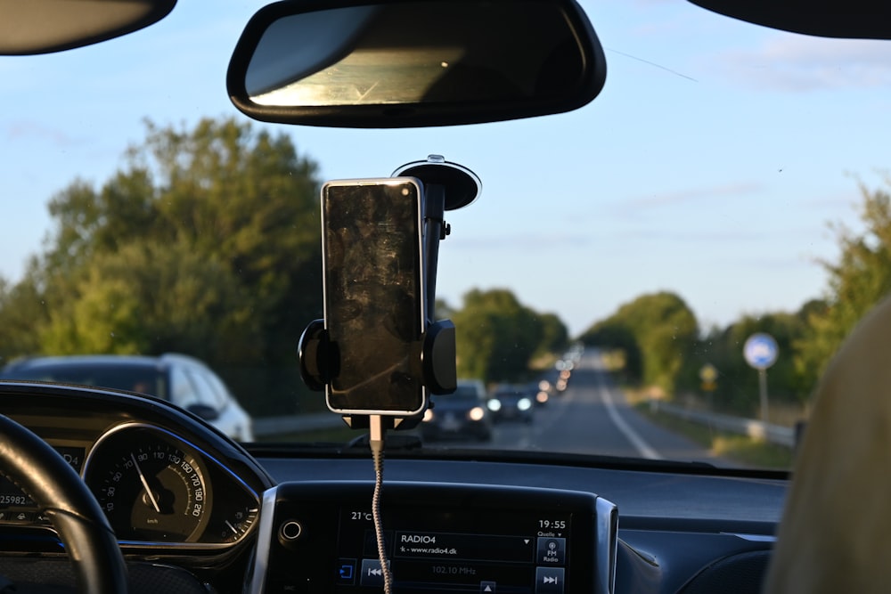 Suction cup phone mount on car dashboard