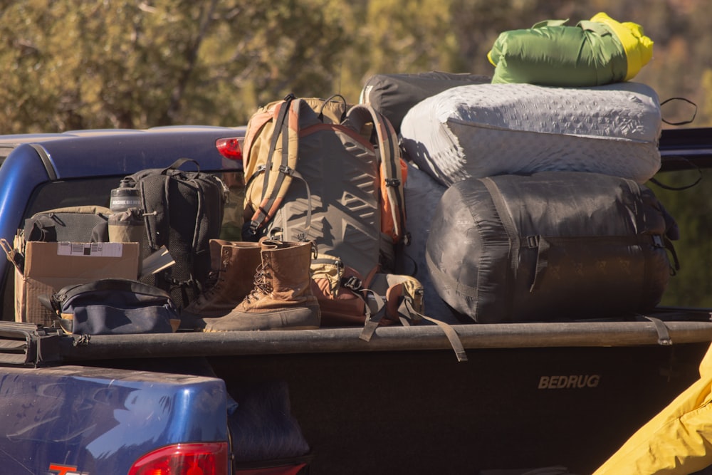 Back of truck loaded with luggage and cargo