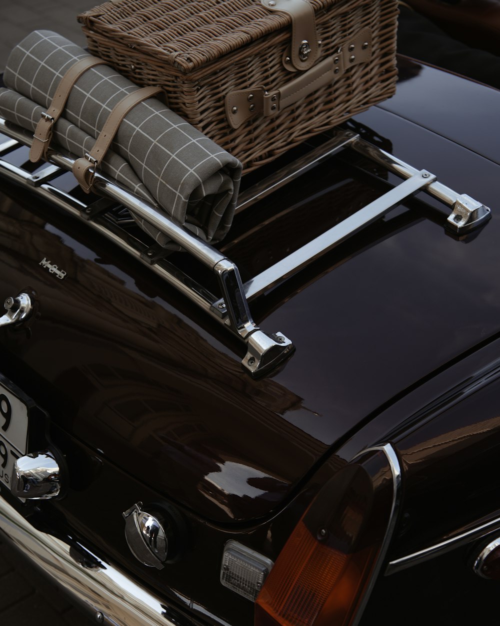 Black car with roof cargo basket rack