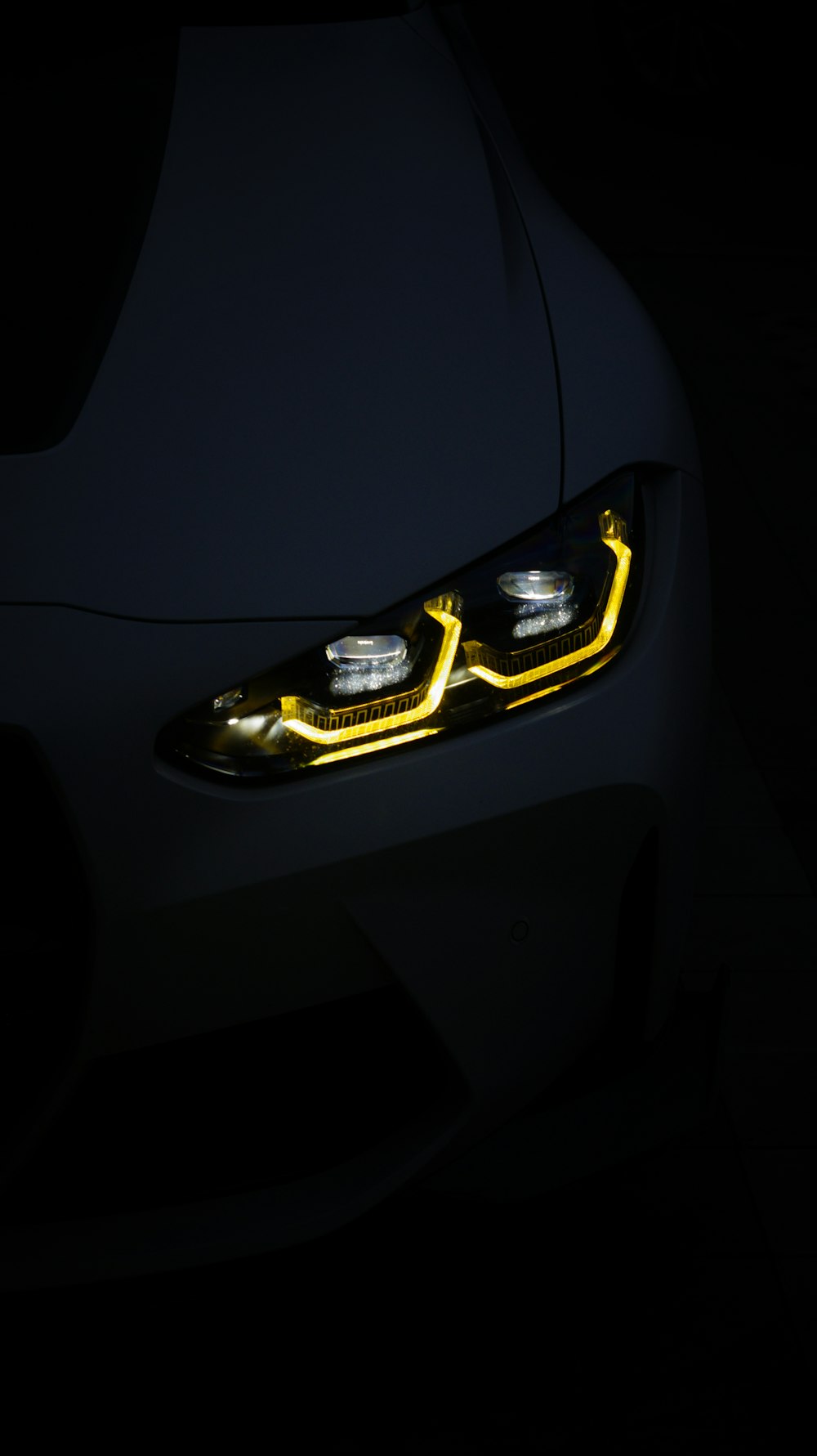Close up of a car headlight in the dark