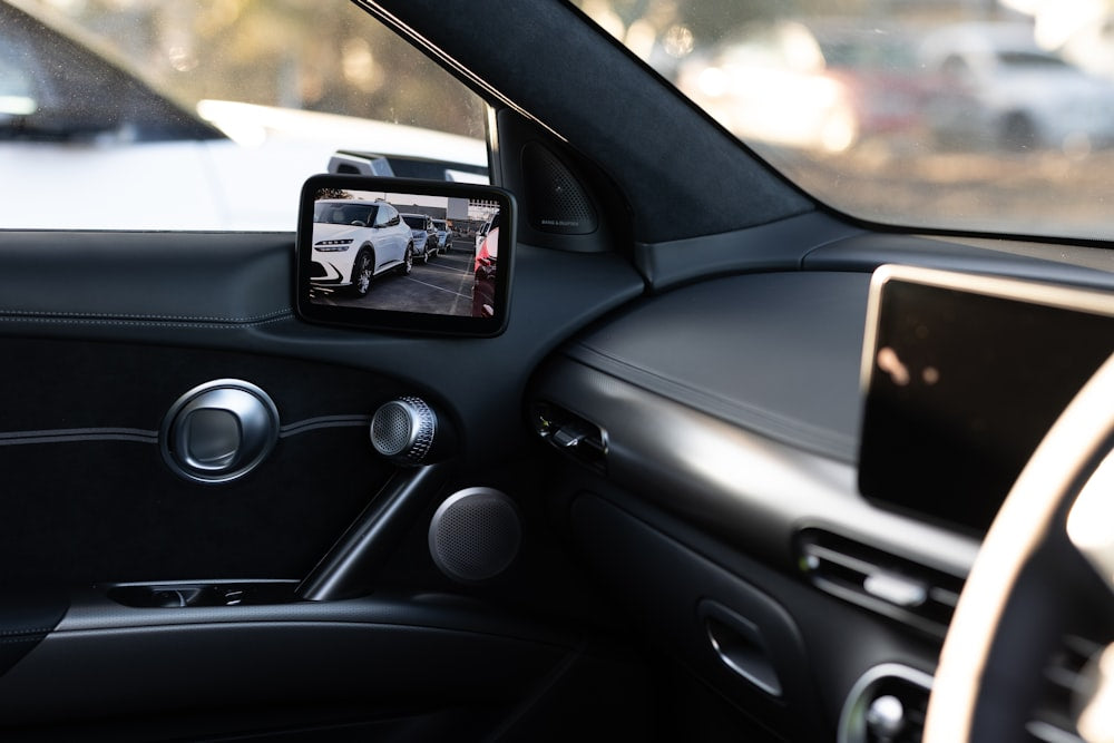 Car interior rearview mirror view on road trip