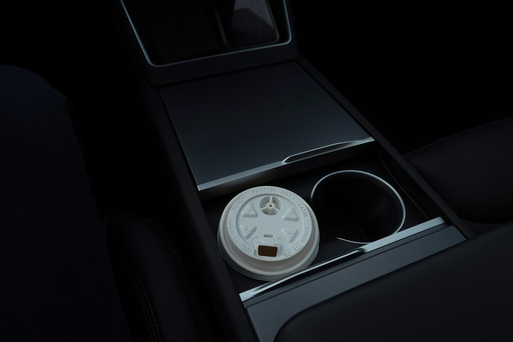 Disposable coffee cup in a car's cup holder