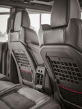 Interior view of black leather car seats with storage pockets