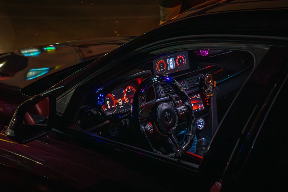 Colorful illuminated interior of a modern car at night
